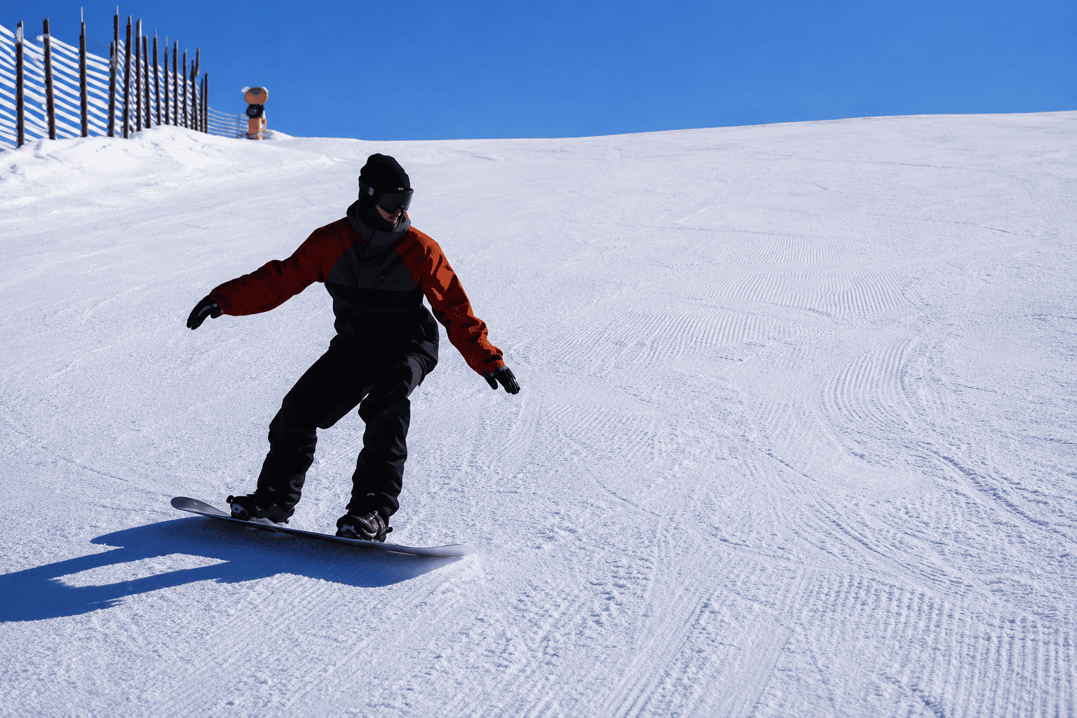 Intermediate skier carving a parallel turn